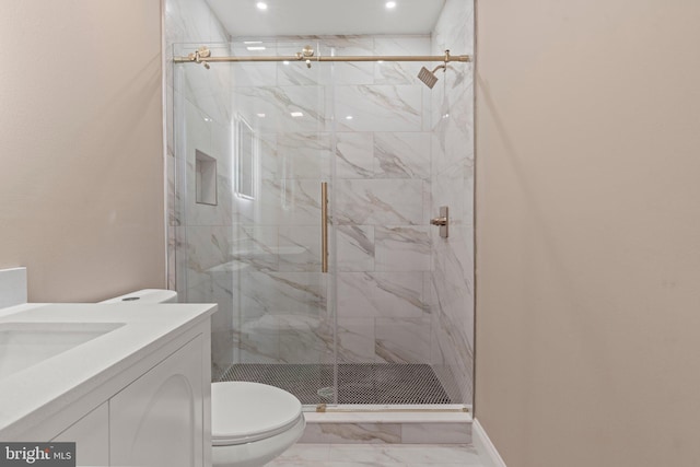 full bathroom featuring a marble finish shower, toilet, marble finish floor, and vanity