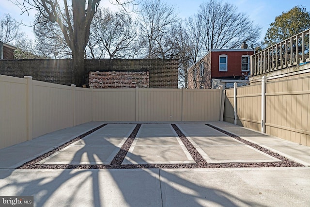 view of patio / terrace featuring fence