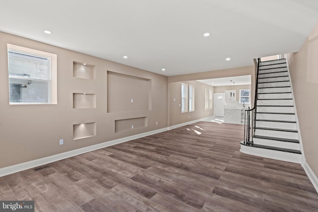 entryway featuring stairs, recessed lighting, wood finished floors, and baseboards