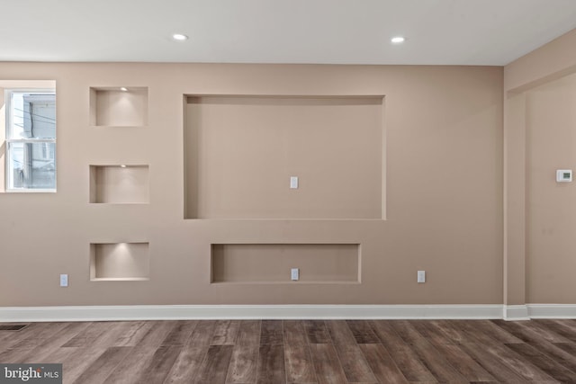 spare room featuring recessed lighting, wood finished floors, visible vents, and baseboards