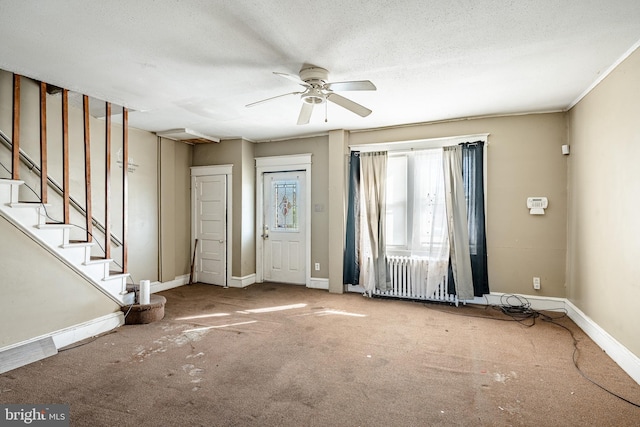 1121 E 22nd St, Wilmington, DE 19802 - carpeted entrance foyer with stairs, ceiling fan, baseboards, and radiator