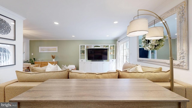 living room featuring crown molding and recessed lighting