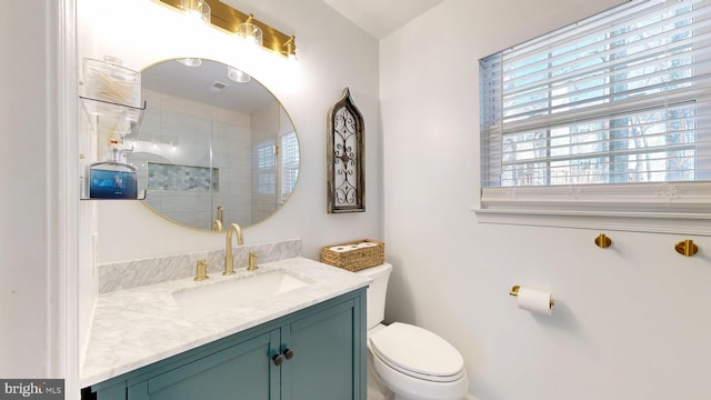 full bathroom featuring an enclosed shower, toilet, vanity, and visible vents