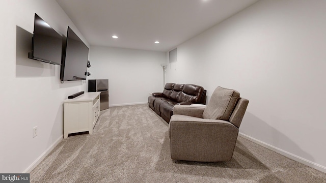 living room with visible vents, recessed lighting, light colored carpet, and baseboards