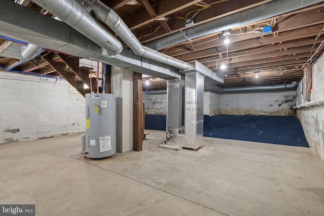 unfinished below grade area with heating unit and electric water heater