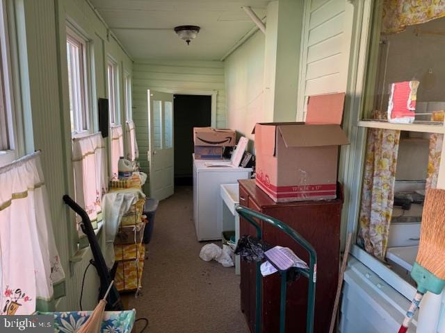 laundry room with washer and clothes dryer, laundry area, and carpet flooring