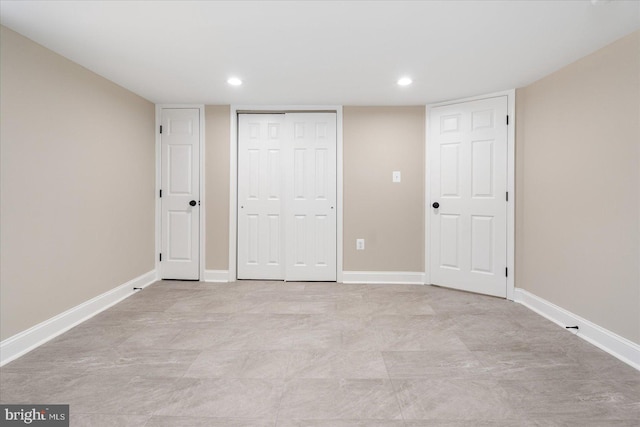 unfurnished bedroom featuring recessed lighting, a closet, and baseboards