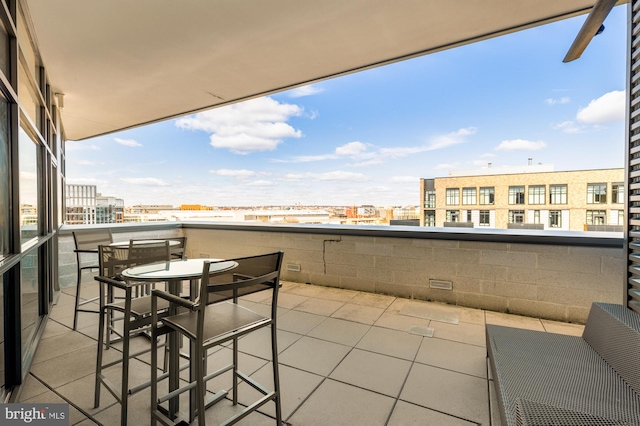 exterior space with a view of city and a balcony