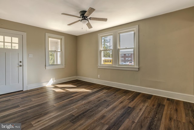 entryway with ceiling fan, baseboards, and dark wood finished floors