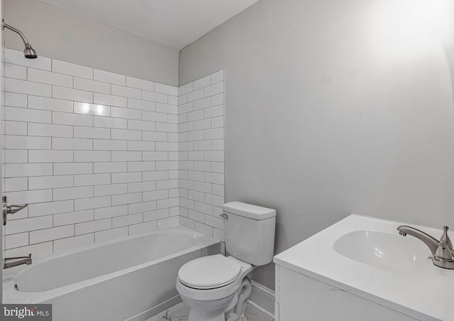 bathroom featuring vanity, toilet, baseboards, and shower / washtub combination