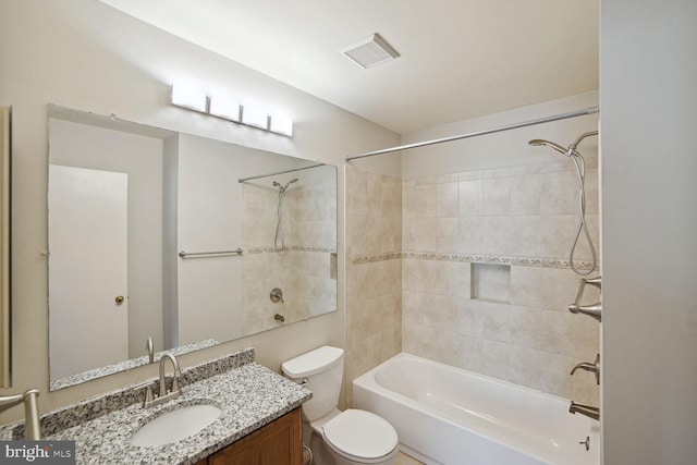 full bath with vanity, toilet, tub / shower combination, and visible vents