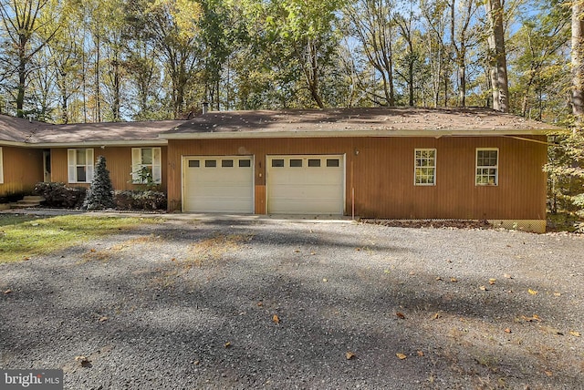 exterior space featuring driveway and a garage