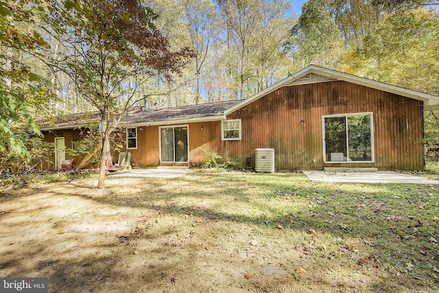 back of house with a patio