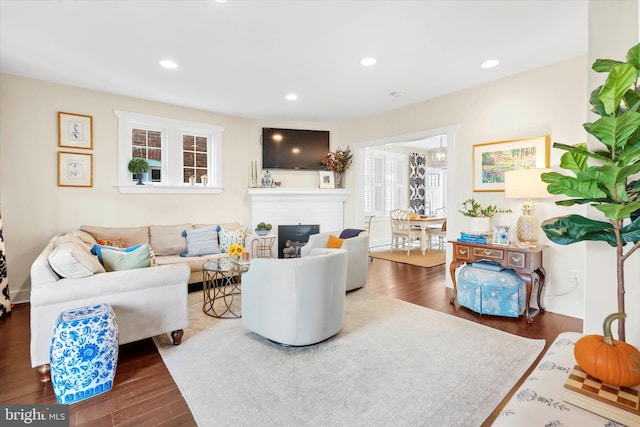 living room with recessed lighting and wood finished floors