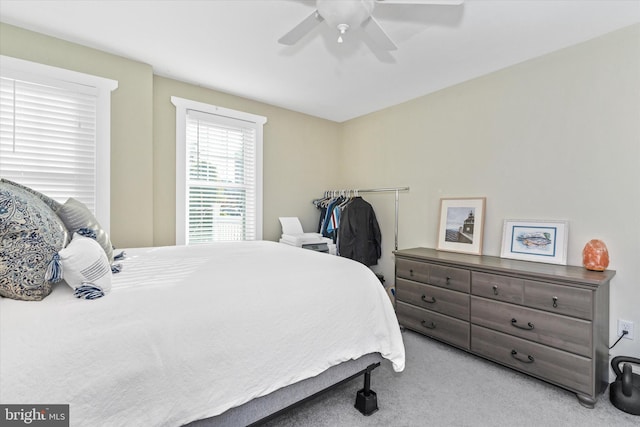 bedroom featuring a ceiling fan and carpet floors