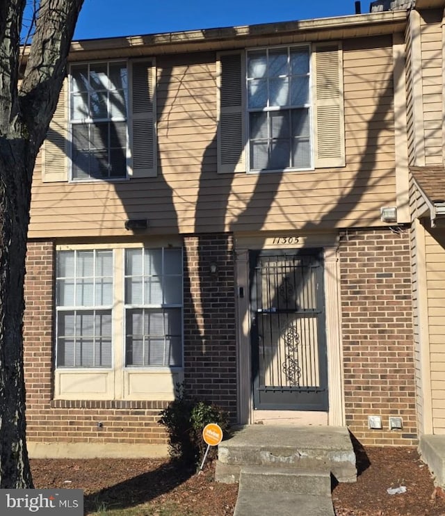 exterior space with brick siding