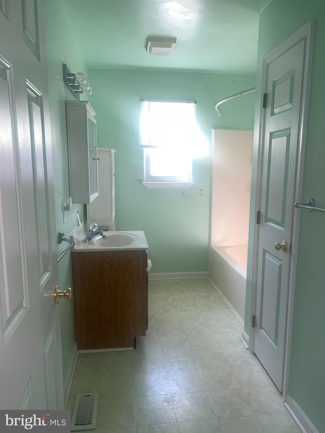 bathroom with visible vents, toilet, shower / tub combination, baseboards, and vanity