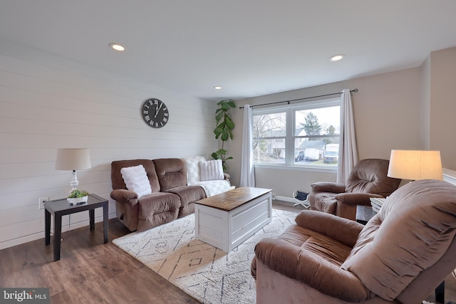 living room with recessed lighting and wood finished floors