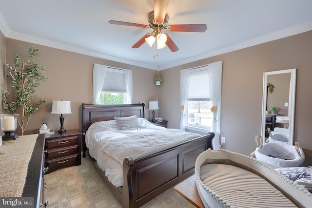 bedroom with multiple windows, a ceiling fan, and ornamental molding