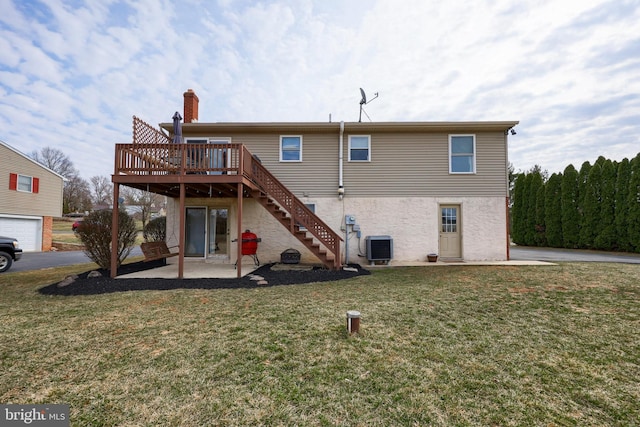 rear view of property featuring central air condition unit, a lawn, a deck, a patio, and stairs