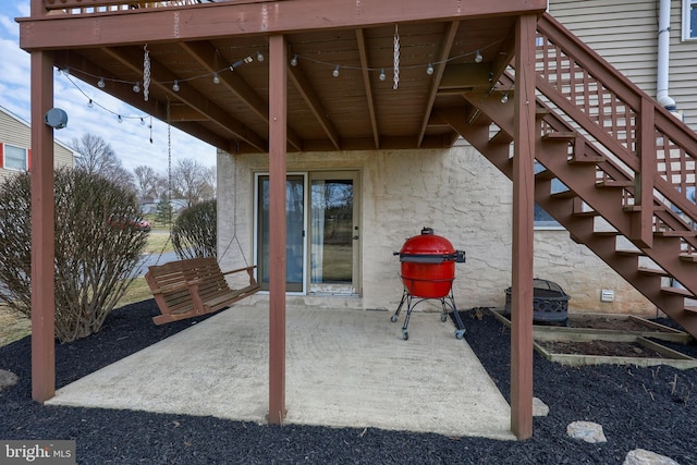 view of patio / terrace featuring stairway