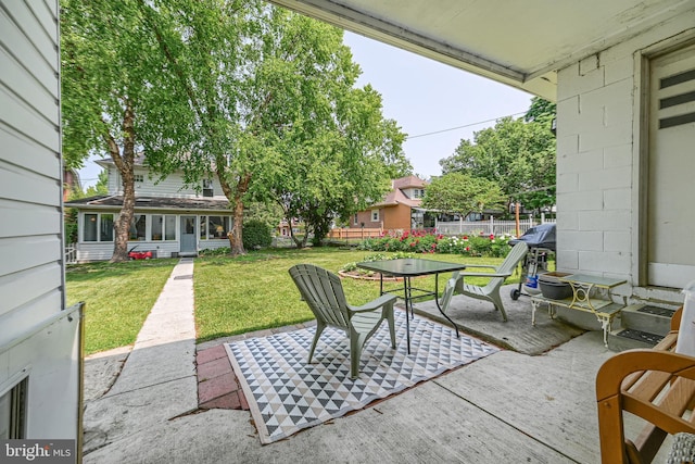 view of patio / terrace featuring fence