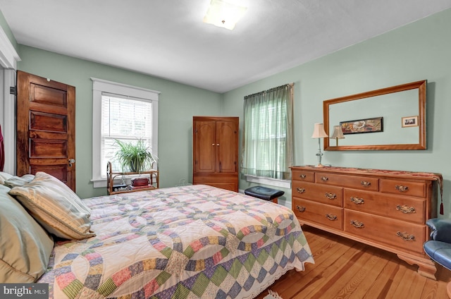 bedroom with wood finished floors