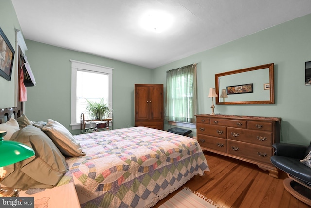 bedroom featuring wood finished floors