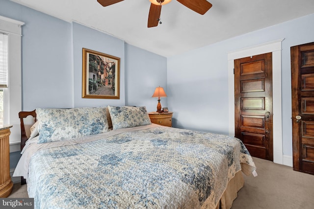 bedroom with a ceiling fan and carpet floors