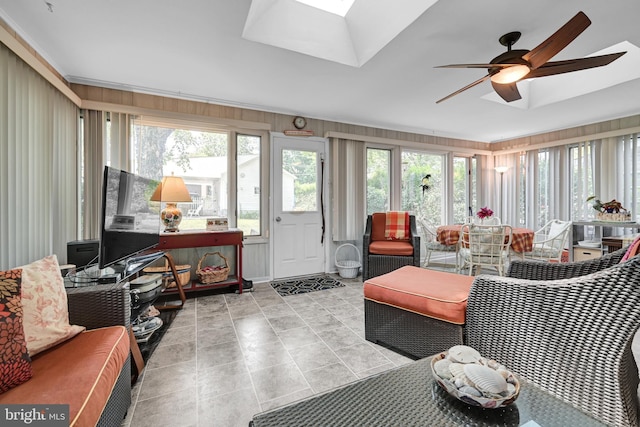 sunroom with a skylight and ceiling fan