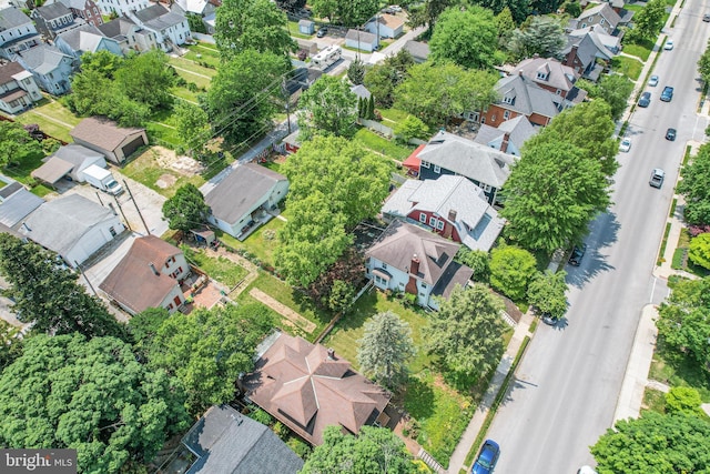 birds eye view of property with a residential view