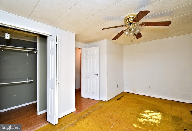 unfurnished bedroom with baseboards, a closet, and ceiling fan