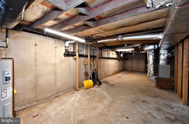 unfinished basement with electric water heater