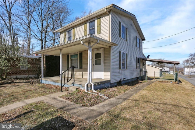 view of front of house featuring covered porch and a front yard