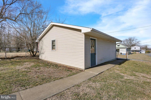 view of home's exterior featuring a yard and fence