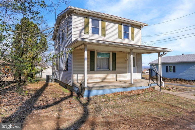 view of front of home featuring central AC unit and covered porch