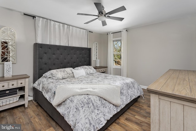 bedroom with dark wood-type flooring, baseboards, and ceiling fan