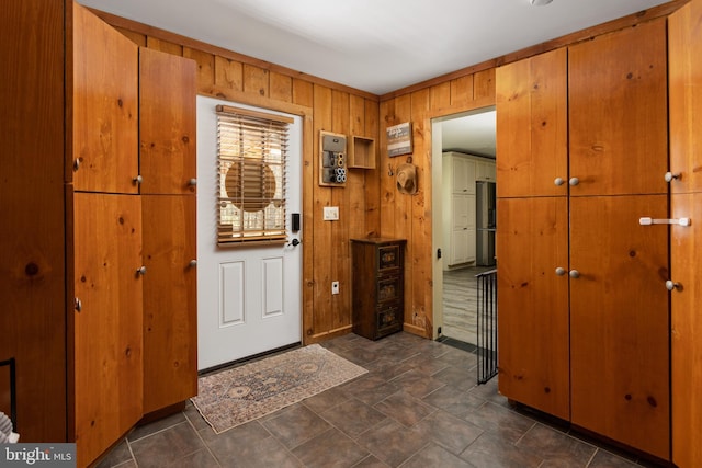 foyer entrance with wood walls