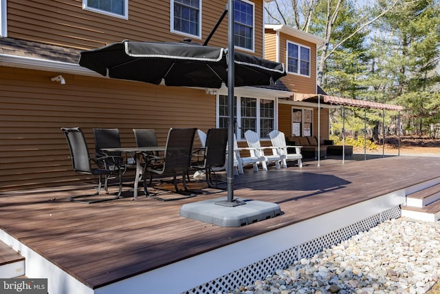 wooden deck with outdoor dining area