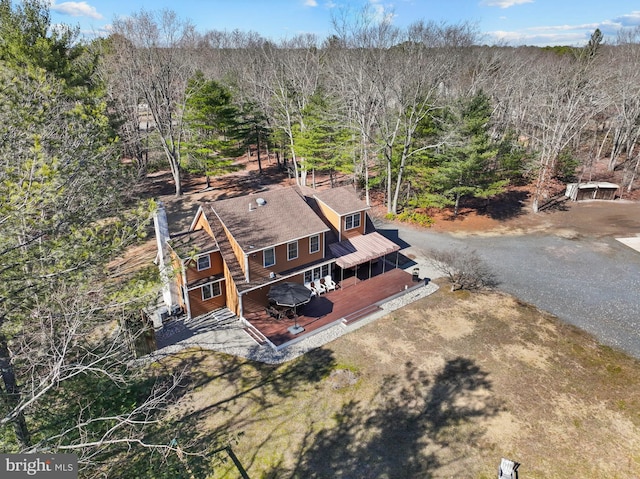 aerial view featuring a view of trees