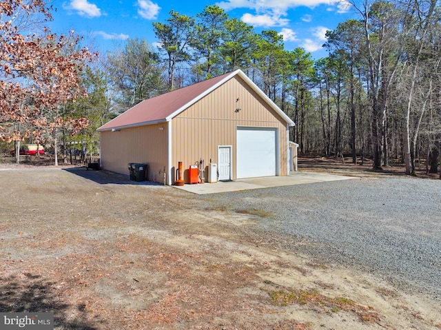 detached garage featuring driveway