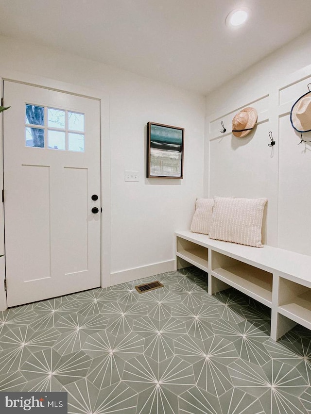 mudroom featuring baseboards