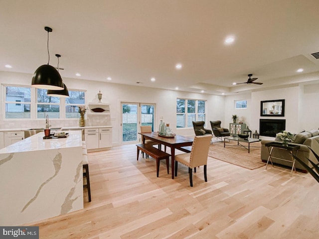 dining space featuring recessed lighting and light wood finished floors