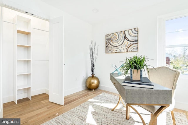 interior space with light wood-style flooring and baseboards