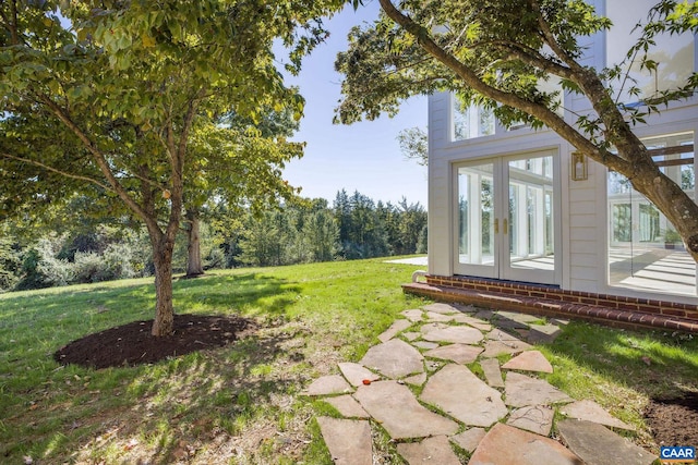 view of yard featuring french doors