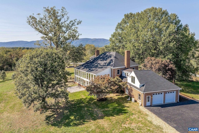 birds eye view of property with a mountain view