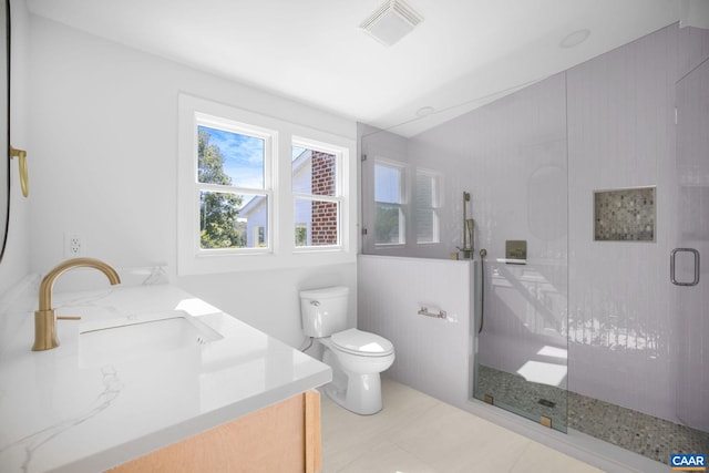 bathroom featuring visible vents, a stall shower, toilet, and vanity