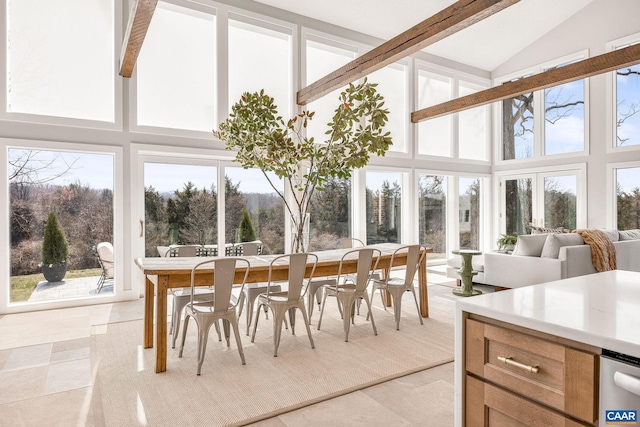 sunroom / solarium featuring vaulted ceiling with beams and plenty of natural light