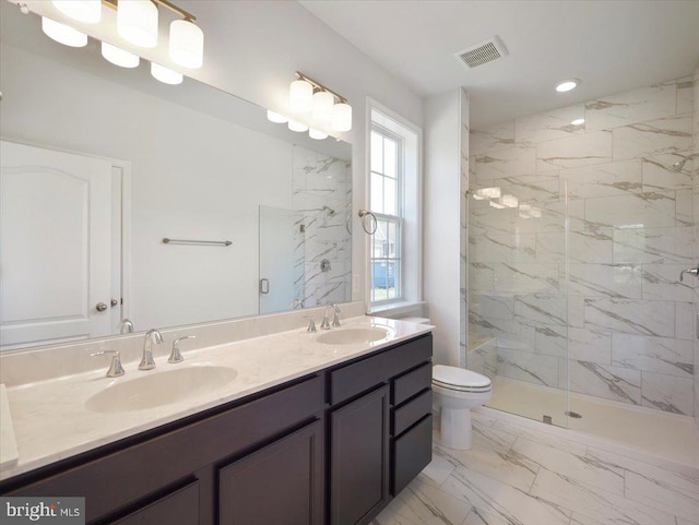 bathroom with a sink, visible vents, toilet, and marble finish floor