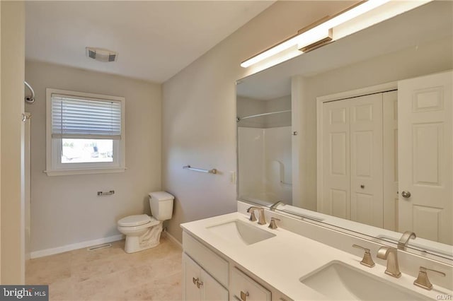 bathroom featuring walk in shower, toilet, visible vents, and a sink